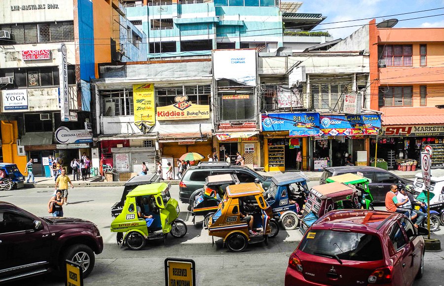 Tagbilaran city centre - tricycles waiting for customers