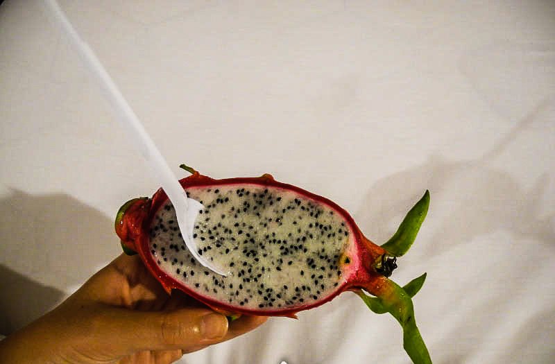 A dragon fruit cut in half (pitahaya)